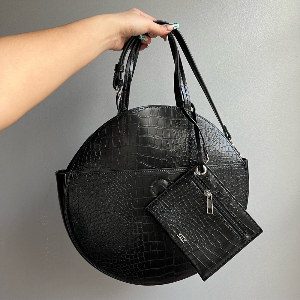 black circle crocodile bag